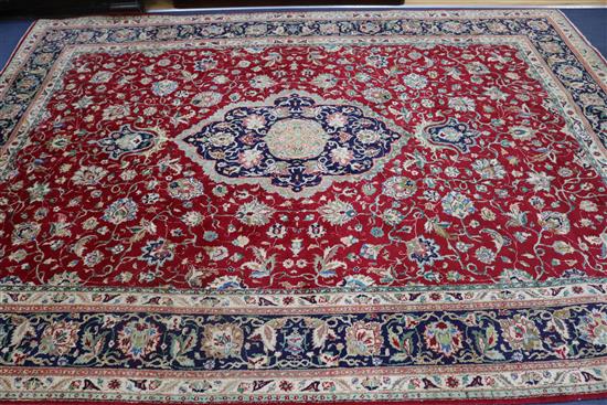 A Tabriz red ground carpet, 340 x 250cm